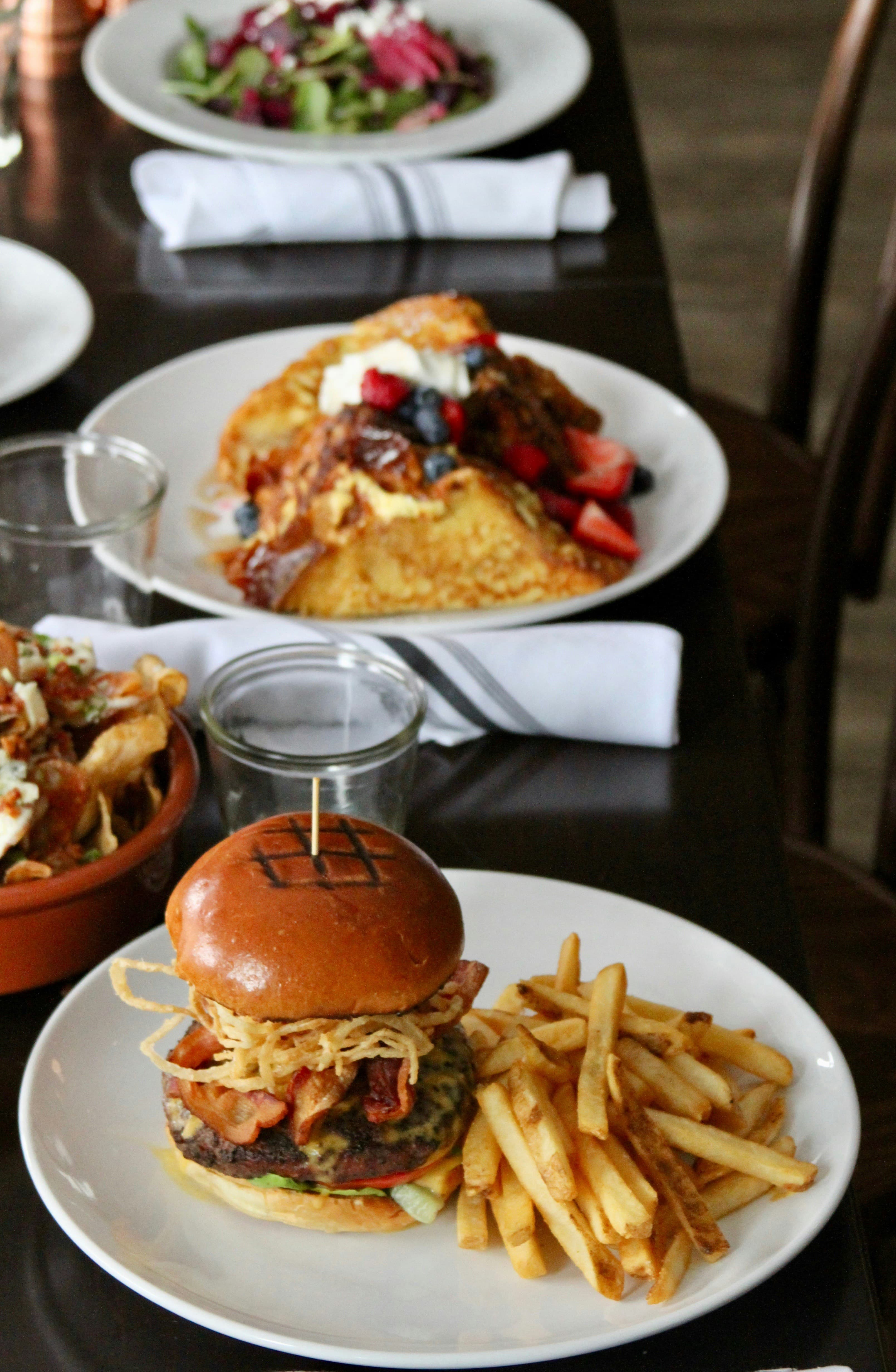 Delicious burger with fries on a restaurant table